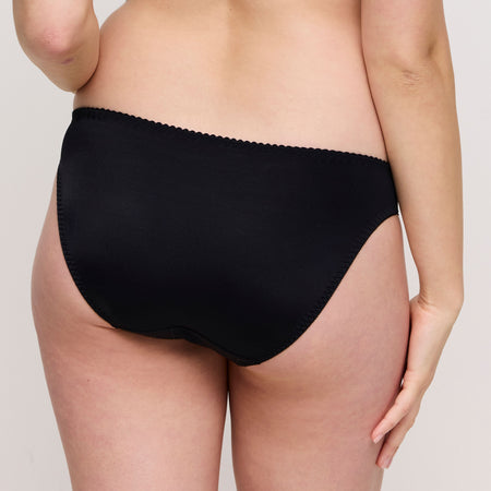 The image of the back of the Deauville Brief in Black. Showcasing the non-seen-through full coverage and a delicate lacy elastic band to prevent any visible panty lines.