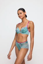 Load image into Gallery viewer, Woman wearing a floral lingerie set against a white background.
Featuring the Lizelot heart shaped bra and a Lizelot full brief in Bali Green.

