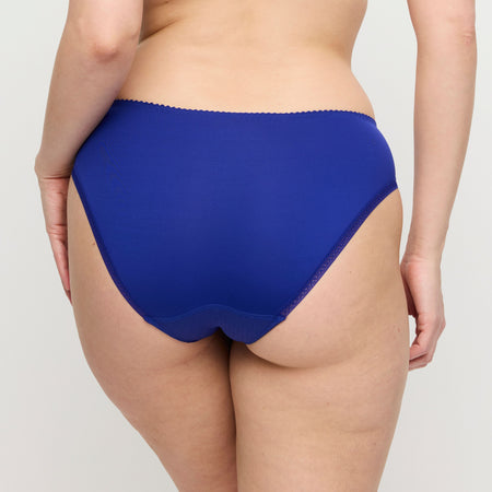The image of the back of the Deauville Brief in Iconic blue. Showcasing the non-seen-through full coverage and a delicate lacy elastic band to prevent any visible panty lines.