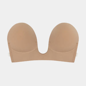 A beige strapless / backless underwire bra shown from the front on a light gray background.