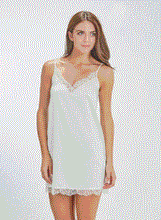 Load image into Gallery viewer, SALE Classic, short silk satin night/slip. Made from 92% silk satin and with a little Elastane for stretch and movement.  Chantilly lace on the V neck and hem. Adjustable spaghetti straps and all French seams for softness when wearing. This garment is perfect for sleepwear or as a slip under clothing. Generous sizing, if in doubt select the smaller size.   Oscalito Silk is Certified GOTs Fabric Content: 92% Silk 8% Elastane Made in Italy. Machine washable. Ivory.
