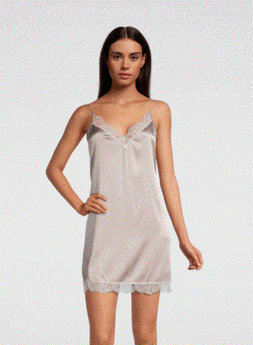 SALE Classic, short silk satin night/slip. Made from 92% silk satin and with a little Elastane for stretch and movement.  Chantilly lace on the V neck and hem. Adjustable spaghetti straps and all French seams for softness when wearing. This garment is perfect for sleepwear or as a slip under clothing. Generous sizing, if in doubt select the smaller size.   Oscalito Silk is Certified GOTs Fabric Content: 92% Silk 8% Elastane Made in Italy. Machine washable. Champagne. 