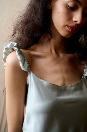 Pure Silk Camisole, Crop-Top and Half Slip with a playful puffed detail on the camisole shoulder, under the bust on the crop-top and on the hem of the half-slip. The crop-top has adjustable straps for the perfect fit.  Made by Luuna Mine; an artisan design studio based in Shanghai, from heavy weight pure silk satin, these items are perfect for sleepwear, leisure wear or daywear. May be bought separately or as a 3-piece set. Composition: Pure Silk Satin. Machine washable. Duck Egg Blue Camisole. 