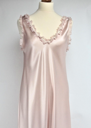 Gorgeous V neck full length nightgown in a heavy weight pure silk satin. This nightgown has wide straps for pure comfort when sleeping. It will not slip from the shoulders and will stay in place. The back is nicely high for warmth and style. There is a silk chiffon ruffle around the neck and shoulders for softness and femininity. The nightgown is cut on the bias, with a side slit, for full movement.  Fabric Content: 100% Pure Silk Made in Italy