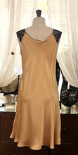 Load image into Gallery viewer, Classic, short night/slip. Made from 100% silk satin. The wide lace straps have a gentle elasticity for fit and comfort.  Appliqué lace detail continues to the round neck. Cut on the bias for movement and swing. This garment is perfect for sleepwear or loungewear. Generous sizing, if in doubt select the smaller size.   100% Silk Satin. Lace: 78% Nylon, 16% Elastane, 6% Polyester. Made in Italy. Machine washable.
