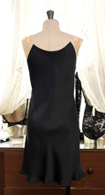 Load image into Gallery viewer, Black/Ecru. Classic, short night/slip. Made from 100% silk satin. The wide lace straps have a gentle elasticity for fit and comfort.  Appliqué lace detail continues to the round neck. Cut on the bias for movement and swing. This garment is perfect for sleepwear or loungewear. Generous sizing, if in doubt select the smaller size.   100% Silk Satin. Lace: 78% Nylon, 16% Elastane, 6% Polyester. Made in Italy. Machine washable.
