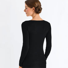 Load image into Gallery viewer, Image of the back of a woman wearing the black silk cashmere top. 
