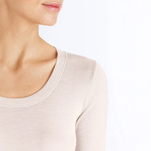 Load image into Gallery viewer, A close up of the vanilla silk cashmere top. Showcasing the soft edging around the neck.

