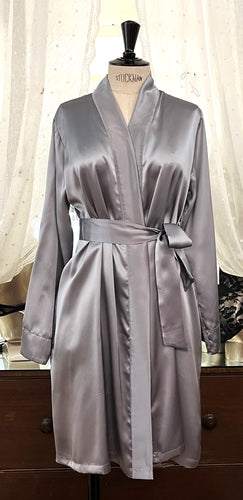 Made in Florence, Italy, Short (knee length) beautiful Pure Silk Robe.  Belted at the waist with concealed side pockets. Kimono style collar. French seams throughout for softness. Wonderful to wear over any item or nightwear, or to match with our Clara Rossi Night/Slips and Pyjamas.  Composition :  Pure Silk Satin. Silver.