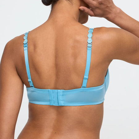 Light blue bra worn by a model on a plain background