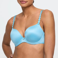 Load image into Gallery viewer, Light blue bra with decorative straps worn by a model on a plain background
