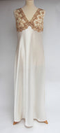 Magnificent wide shoulders, heavy silk full length nightgown. The beautiful lace bodice is fully lined for compete coverage. The wide straps allow for comfort when sleeping. The full length ivory bias cut skirt also has a slit for extra ease of movement. This is a top quality, classic style nightgown.  Fabric Content: 100% Pure Silk  Made in Italy