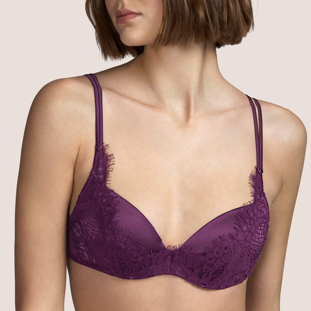 Formed Plunge bra. The Leavers lace over the centre of the cup. The cups and double rouleau straps are made of silk for perfect softness against the skin. The colour Tourmaline is an Aubergine shade, perfect for all skin tones.  Fabric Content: Polyester: 52%, Silk: 20%, Polyamide: 15%, Cotton: 11%, Elastane: 2% Lace: Leavers.