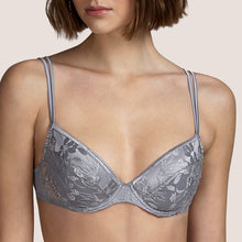 Load image into Gallery viewer, This is a beautiful, moulded embroidered plunge bra. The inside of the cup has a satin lining for smoothness against the skin. There is a removal pad giving the option of two different presentations. The fine double strap offers delicacy with strength.  Andres Sarda is famous for its innovation in its use of fabrics. Tina in Metallic Silver is a perfect example.  Fabric content: Polyester: 74%, Cotton: 13%, Polyamide: 9%, Elastane: 4%
