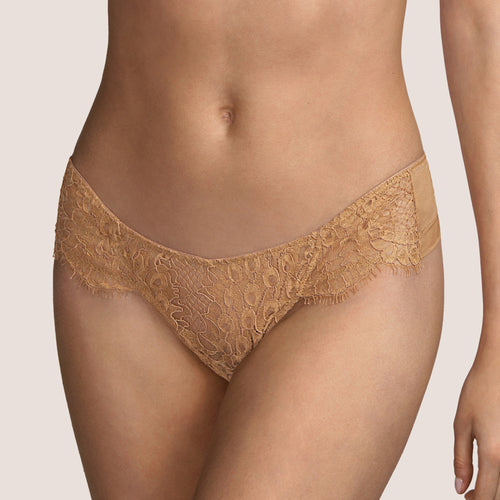 Beautiful low-cut Tanga style G/String. The front made entirely of Leavers lace. The back is a classic style sheer tulle G/String, perfect for smoothness under clothing. The colour Tourmaline is an Aubergine shade, perfect for all skin tones.    Fabric Content: Polyamide: 42%, Polyester: 28%, Cotton: 26%, Elastane: 4%