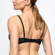 Load image into Gallery viewer, Black lace bra worn by a model on a light gray background

