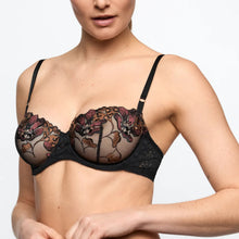 Load image into Gallery viewer, Black lace bra worn by a model on a plain background

