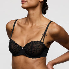 Load image into Gallery viewer, Black lace bra worn by a model on a plain background

