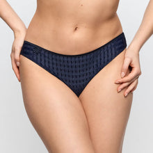 Load image into Gallery viewer, Navy patterned underwear worn by a person on a light gray background
