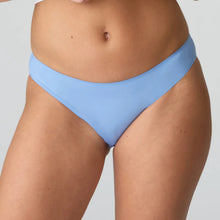 Load image into Gallery viewer, Light blue bikini bottom worn by a person on a plain background
