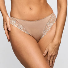 Load image into Gallery viewer, Beige lace underwear on a plain background
