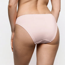 Load image into Gallery viewer, Rear view of a model wearing light pink bikini bottoms with a scalloped edge against a plain light gray background.
