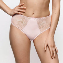 Load image into Gallery viewer, A model wearing light pink lace panties with a solid pink center panel and scalloped edges, shown from the waist to upper thighs against a plain light background.
