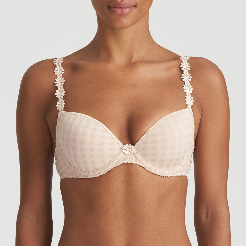 BEST SELLER!  Formed cup, deep plunge underwired smooth bra. It supports the bust and gives a beautiful shape while offering a feminine, plunge effect. The signature daisy straps complete the picture!  Fabric Content: Polyester: 48%, Polyamide: 43%, Elastane: 9%