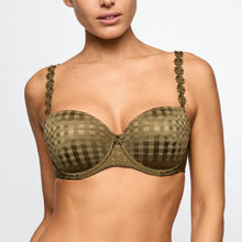 Load image into Gallery viewer, A woman wearing an olive green and brown checkered bra with patterned straps, shown from the neck to the waist against a light gray background.
