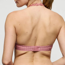 Load image into Gallery viewer, Pink halter top worn by a person on a plain background
