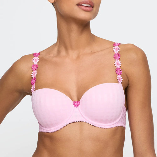 Pink bra with floral straps worn by a model on a plain background