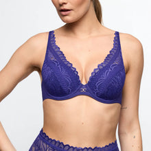 Load image into Gallery viewer, Woman wearing a blue lace bra and underwear set on a light gray background
