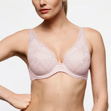 Load image into Gallery viewer, A woman wearing a light pink lace bra with scalloped edges and a center bow, shown from the neck to the lower torso against a plain light background.
