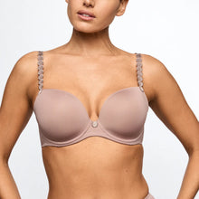 Load image into Gallery viewer, Woman wearing a beige bra with floral straps on a light gray background
