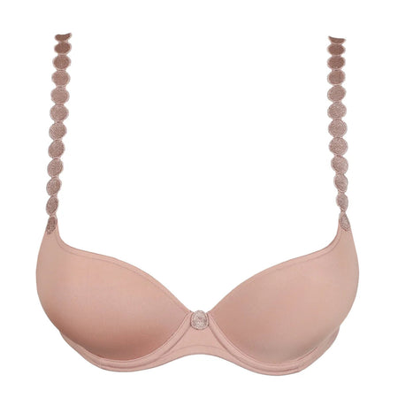 Pink bra with decorative straps on a white background