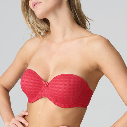 Strapless formed cup underwire bra with a balconnet line. Straight back with silicone strip to give extra support when the bra is worn strapless. Excellent shape and support for those strapless occasions. May also be worn in a halter style. The signature daisy straps complete the picture!  Fabric Content: Polyamide: 49%, Polyester: 41%, Elastane: 10%. Scarlet.