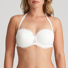 Load image into Gallery viewer, This is the attractive end of the strapless bra market. Beautifully smooth to the front but with a delicate lace trim on the cup to counterbalance any severity. The removable straps, if worn, are dainty and lace trimmed. This bra has the added bonus to create the halter style also. Fabric content: Polyamide: 53%, Polyester: 35%, Elastane: 12%. Ivory.
