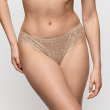 Load image into Gallery viewer, Beige lace underwear worn by a person on a light gray background

