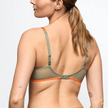 Load image into Gallery viewer, Woman wearing a green and orange bralette on a plain background
