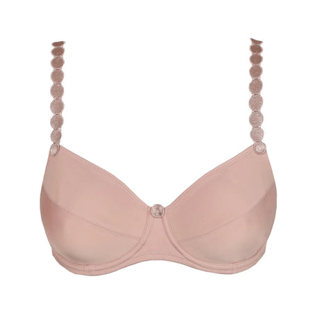 Pink bra with decorative straps on a white background