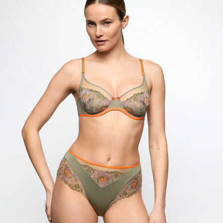 Woman wearing a floral lingerie set on a white background