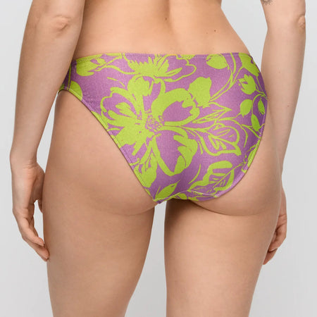 Purple and green floral-patterned bikini bottom on a plain background