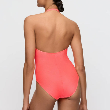 Coral one-piece swimsuit worn by a model on a light gray background
