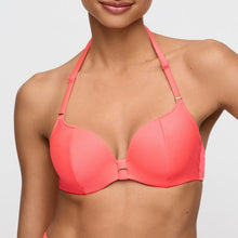 Load image into Gallery viewer, Coral bikini top worn by a model on a light gray background
