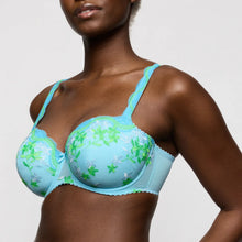 Load image into Gallery viewer, Blue bra with green floral patterns worn by a model on a plain background
