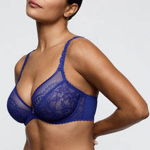 Load image into Gallery viewer, Blue lace bra worn by a model on a plain background
