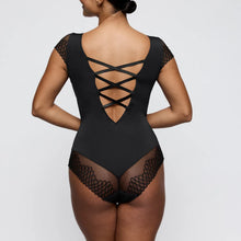 Load image into Gallery viewer, Black lace bodysuit worn by a model on a plain background
