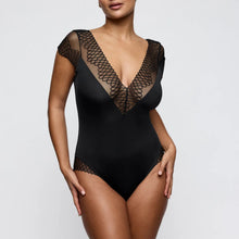 Load image into Gallery viewer, Black lace bodysuit on a model against a plain background
