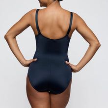 Load image into Gallery viewer, Person wearing a black swimsuit against a plain background
