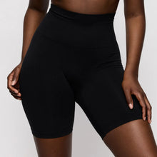 Load image into Gallery viewer, Person wearing black athletic shorts on a plain background
